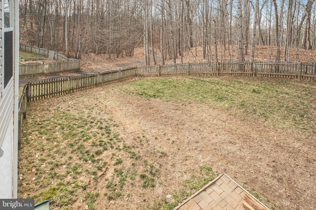 view of yard with a fenced backyard