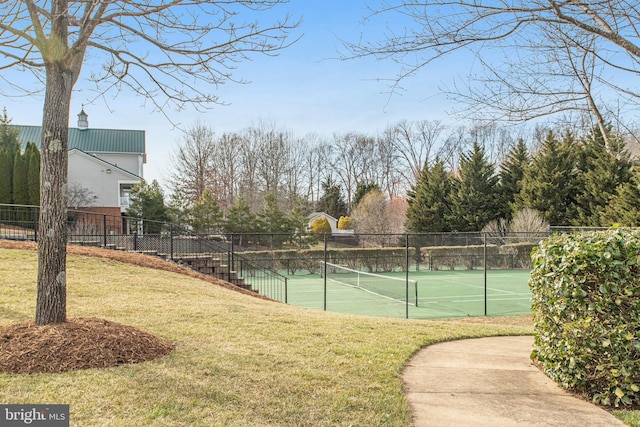 view of sport court featuring a lawn and fence