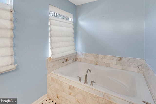 bathroom with a garden tub