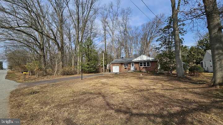 exterior space featuring an attached garage and driveway