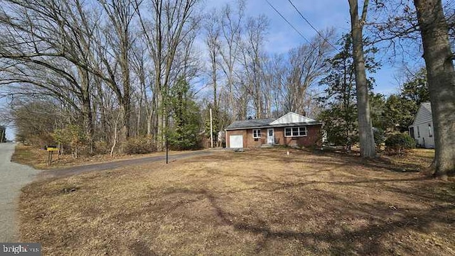 exterior space featuring an attached garage and driveway