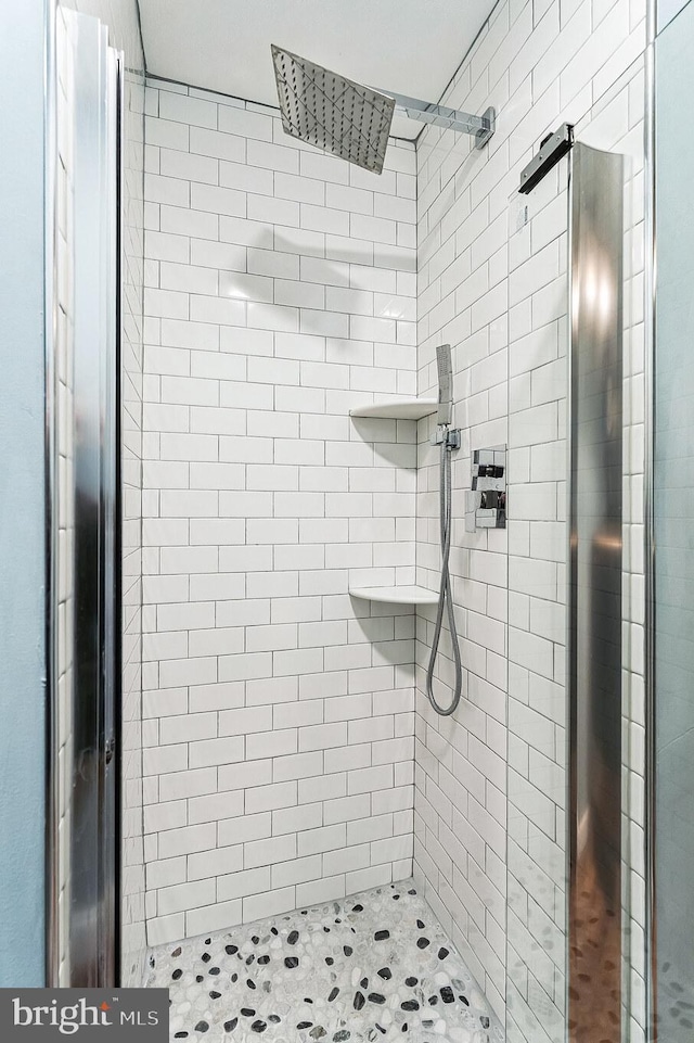 full bath featuring a shower stall