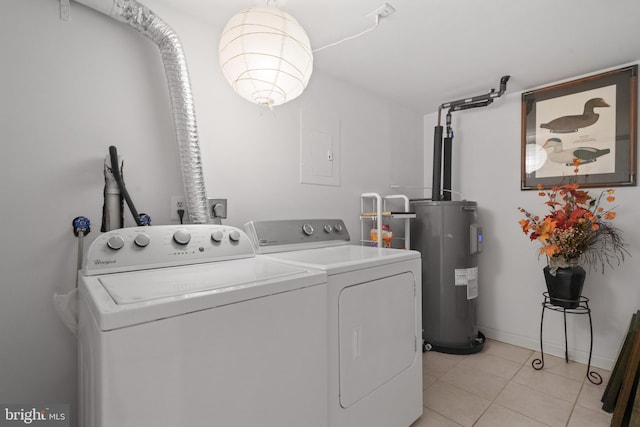 clothes washing area featuring electric panel, water heater, separate washer and dryer, light tile patterned floors, and laundry area