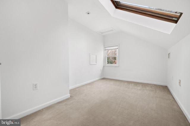 bonus room featuring baseboards, light carpet, and lofted ceiling