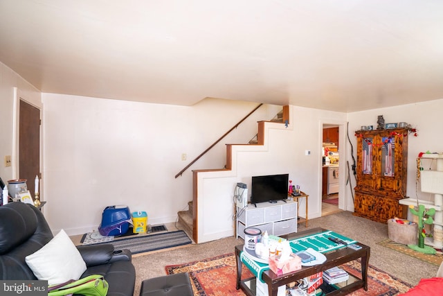 living area featuring stairway, baseboards, and carpet floors