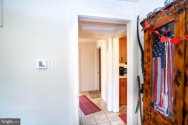 corridor with light tile patterned flooring