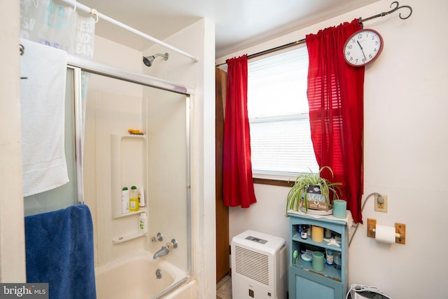 bathroom with bathing tub / shower combination