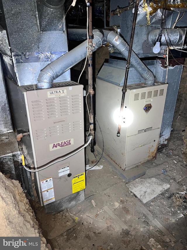 utility room featuring heating unit