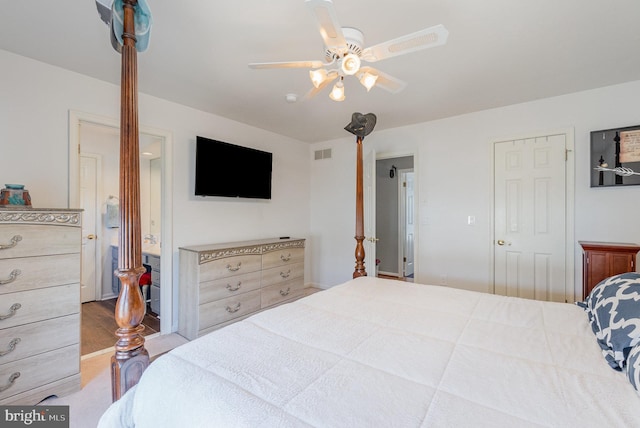 bedroom featuring connected bathroom, visible vents, and ceiling fan