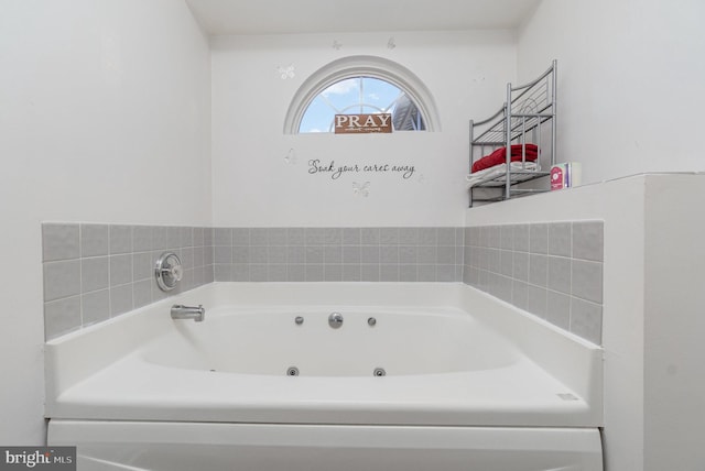 bathroom with a whirlpool tub