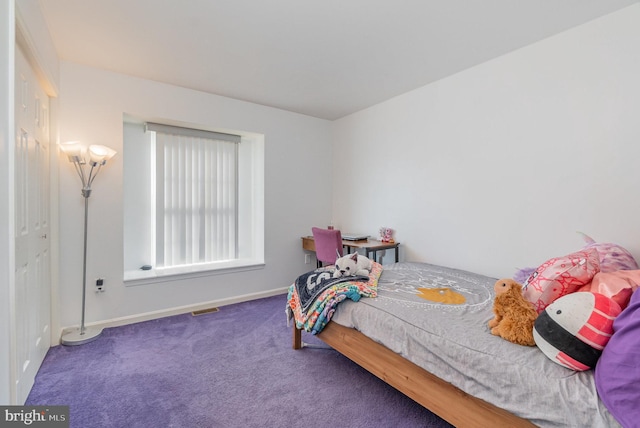 bedroom featuring visible vents, carpet floors, and baseboards