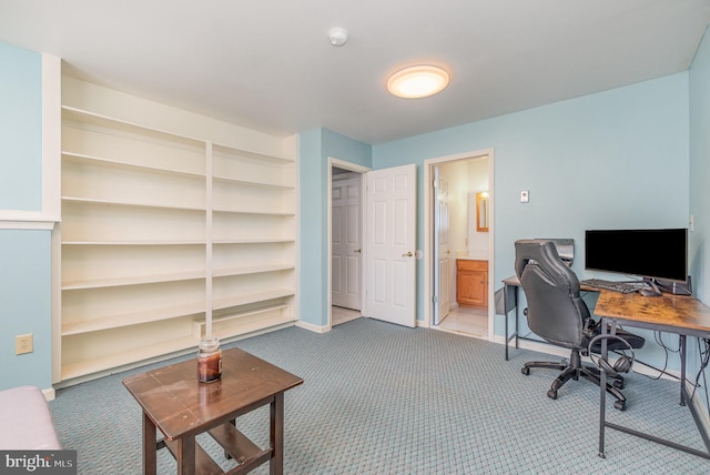 office space featuring carpet and baseboards