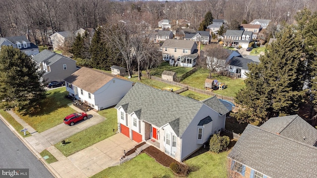 birds eye view of property with a residential view