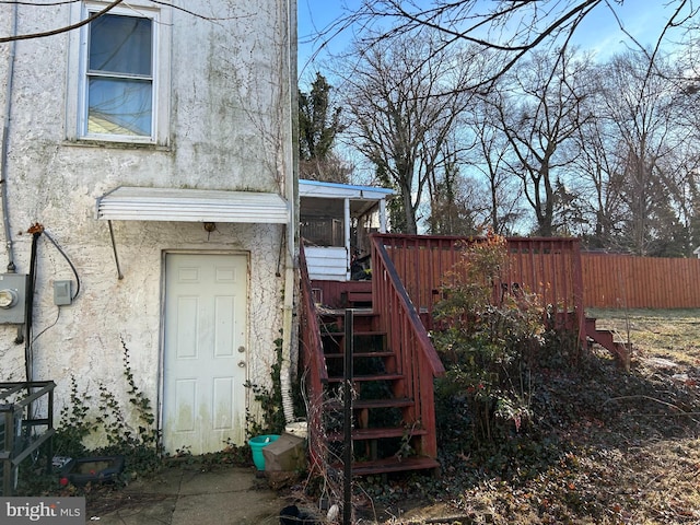 6218 61st Pl, Riverdale, MD 20737 - doorway to property with stucco siding and fence
