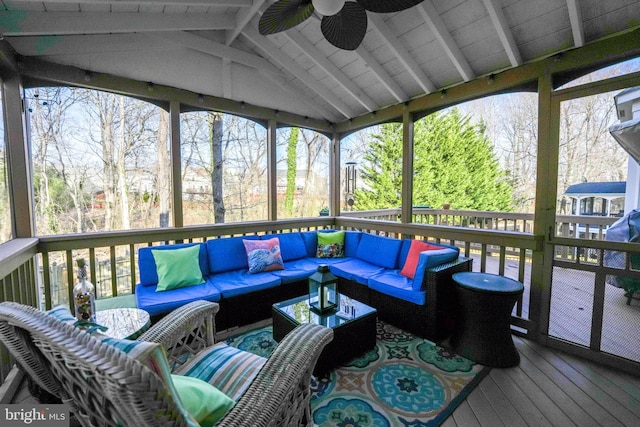 wooden terrace with an outdoor living space and ceiling fan