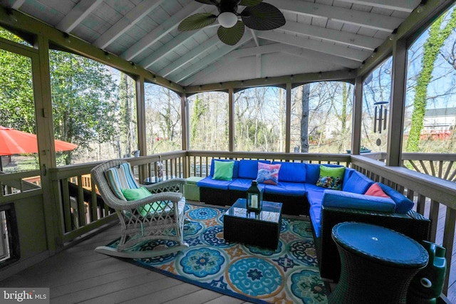 wooden deck with ceiling fan and an outdoor hangout area