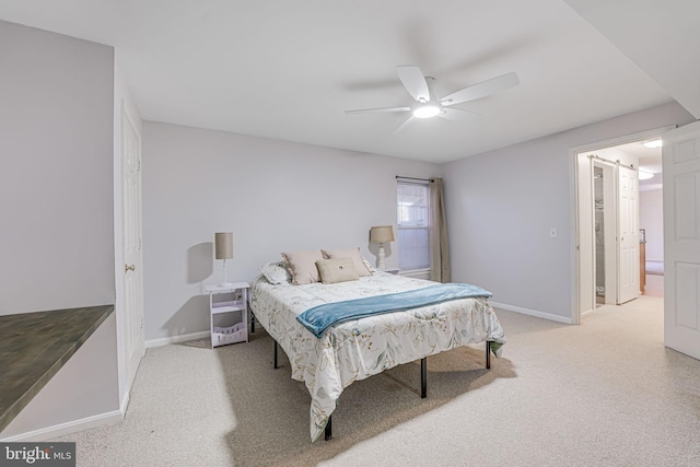 bedroom with baseboards, light carpet, and ceiling fan