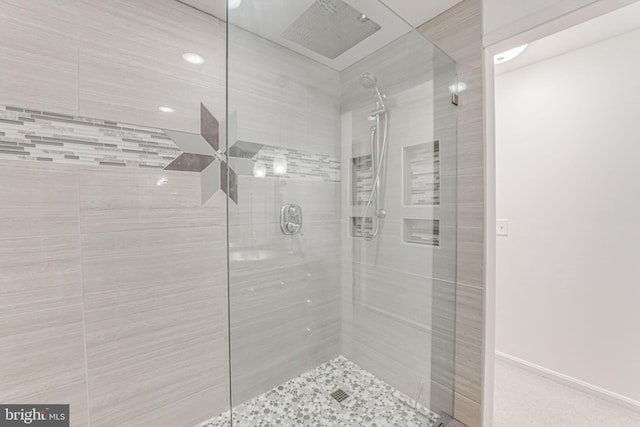 bathroom with tiled shower