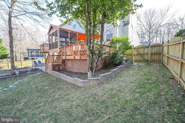 view of yard with stairway, a fenced backyard, a sunroom, and a wooden deck