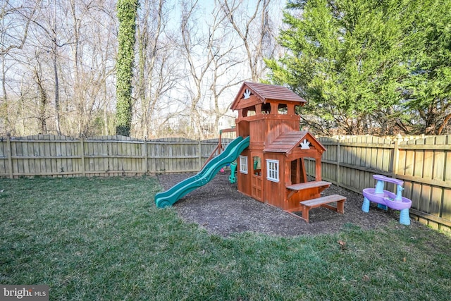 view of jungle gym featuring a yard and a fenced backyard