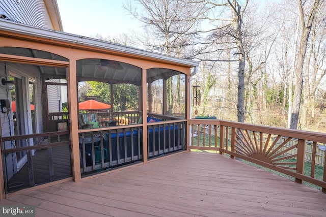 wooden terrace with a sunroom