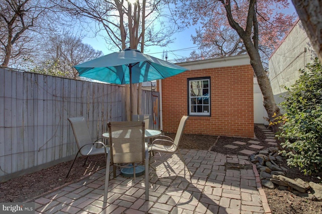 view of patio / terrace with outdoor dining area and a fenced backyard