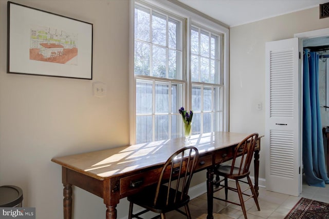 dining area featuring baseboards and visible vents