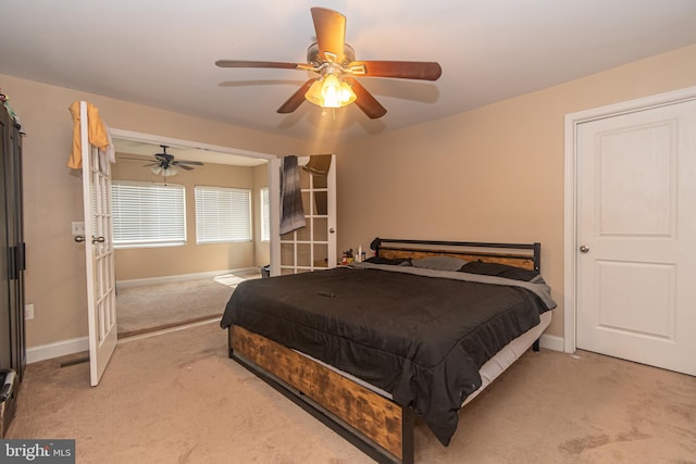 bedroom with carpet flooring, ceiling fan, and baseboards