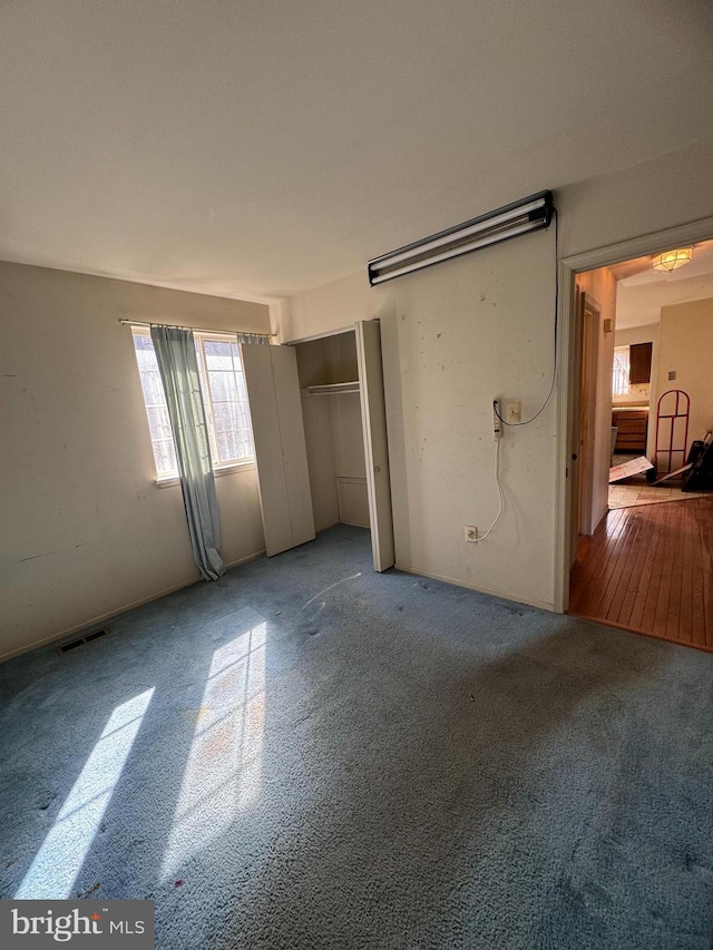 unfurnished bedroom with visible vents