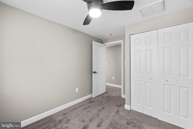 unfurnished bedroom featuring visible vents, baseboards, carpet, a closet, and a ceiling fan