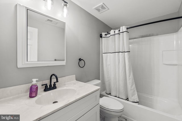 bathroom with vanity, toilet, visible vents, and shower / tub combo with curtain