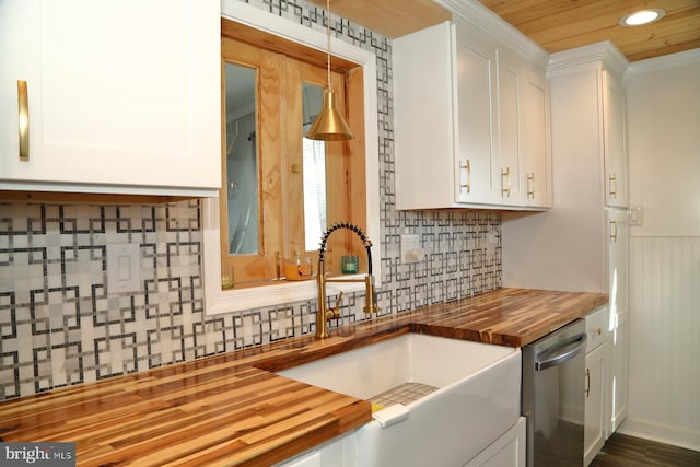 kitchen with a sink, white cabinetry, butcher block countertops, and dishwasher