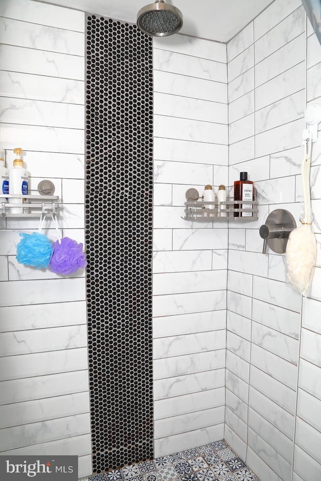 interior space featuring a tile shower