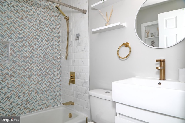 bathroom with vanity, toilet, and bathing tub / shower combination