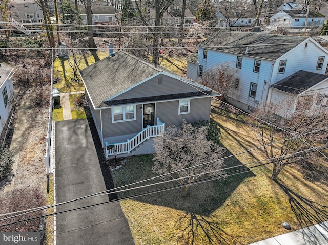 birds eye view of property with a residential view