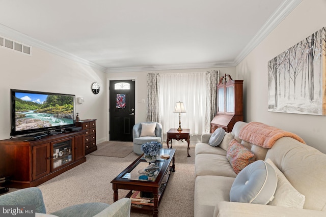 living area with visible vents, ornamental molding, and carpet flooring