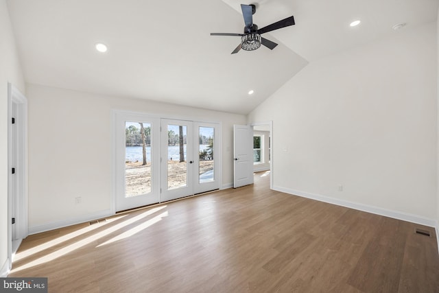 unfurnished living room with recessed lighting, visible vents, baseboards, and wood finished floors