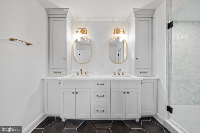 full bathroom with tile patterned flooring, a shower stall, double vanity, and a sink