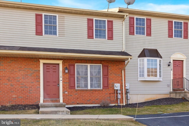 multi unit property featuring brick siding