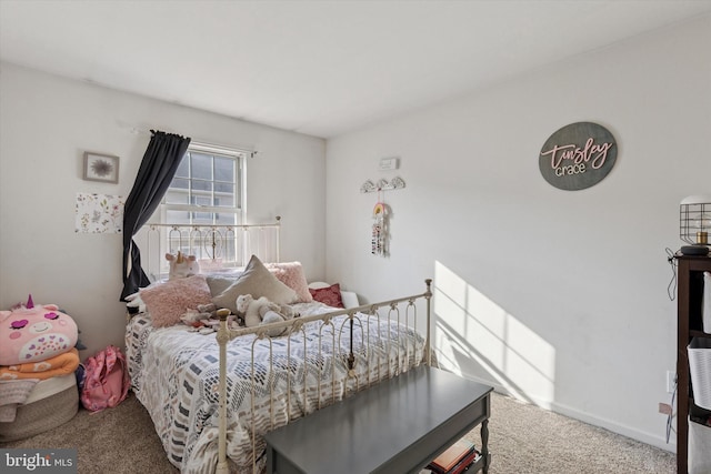 bedroom with carpet flooring and baseboards