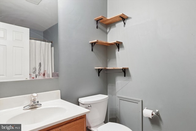 full bathroom with vanity and toilet