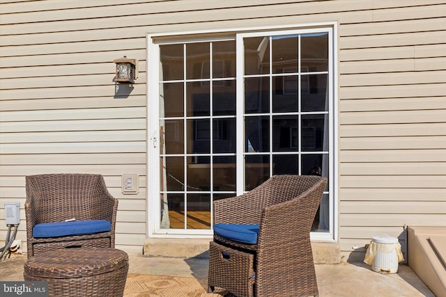 property entrance with a patio area