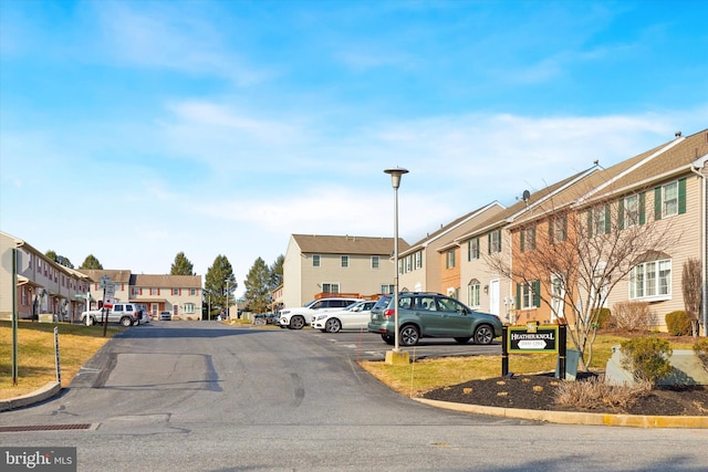 view of street featuring a residential view and street lighting