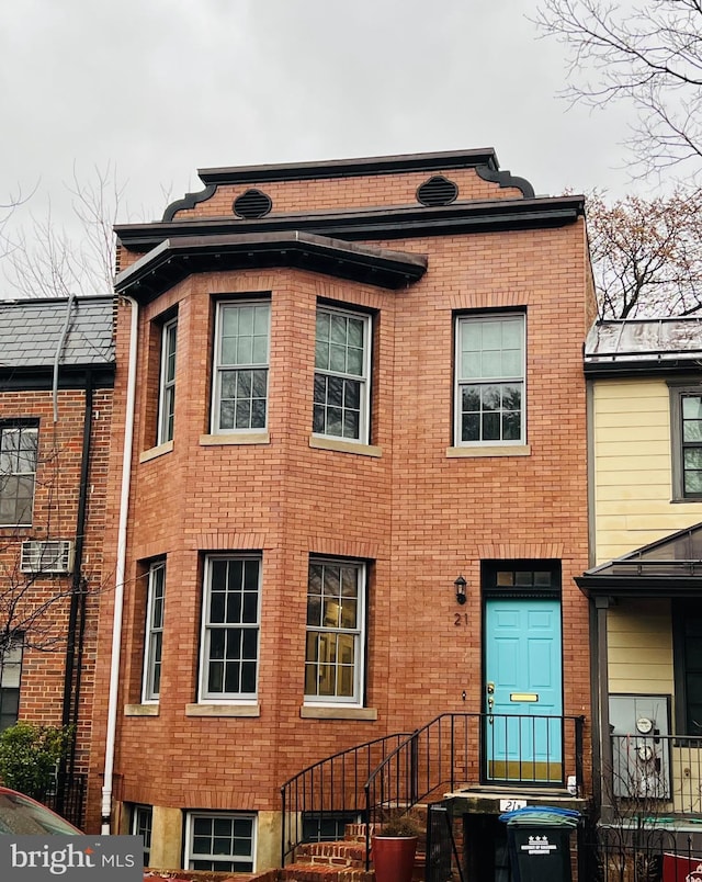 view of front of house with brick siding