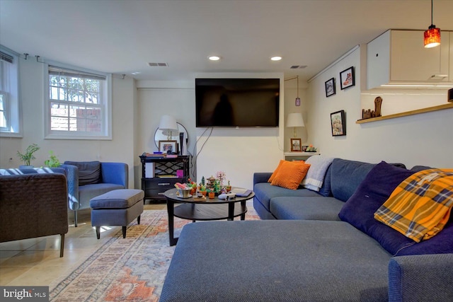 living room featuring visible vents, recessed lighting, and light tile patterned floors