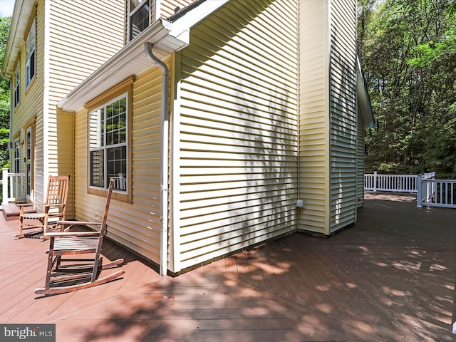 view of side of home with a deck