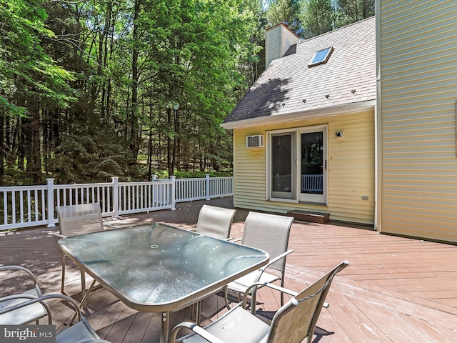 wooden deck with outdoor dining area