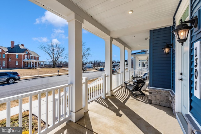 balcony with a residential view and covered porch