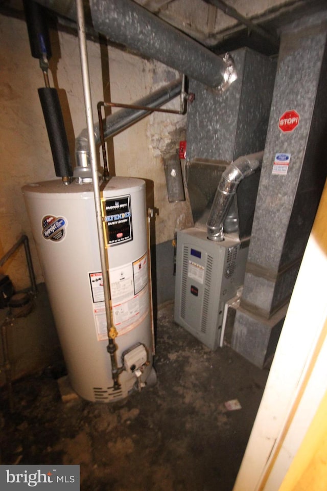 utility room with gas water heater