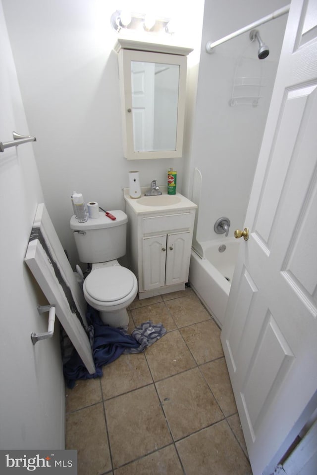 bathroom with tile patterned floors, shower / tub combination, vanity, and toilet